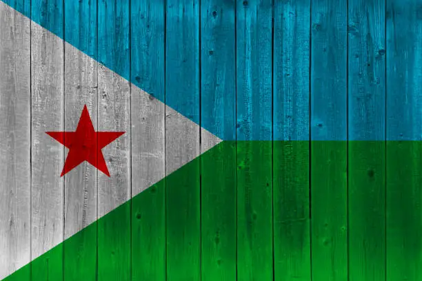 Photo of Djibouti flag painted on old wood plank