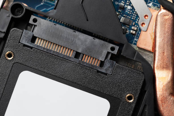 istock installing new solid-state drive to laptop pc. sata and power connection close up.upgrade laptop hardware. 1133888111