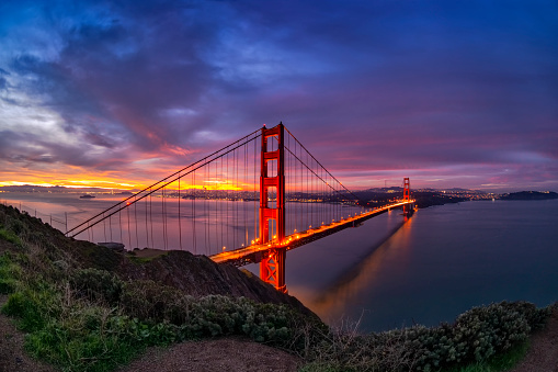 Photo taken over a mountain at San Francisco Bay. The famous Golden Gate bridge.