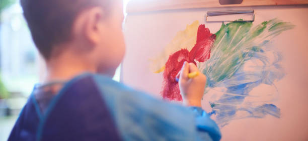 istock Toddlers painting 1133892112