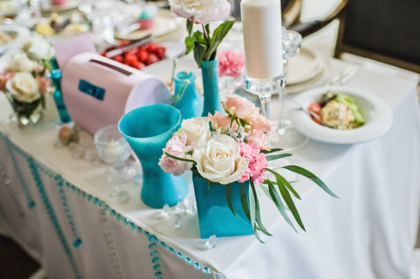 istock Vase with white roses on the table in the restaurant, wedding. 1133896242