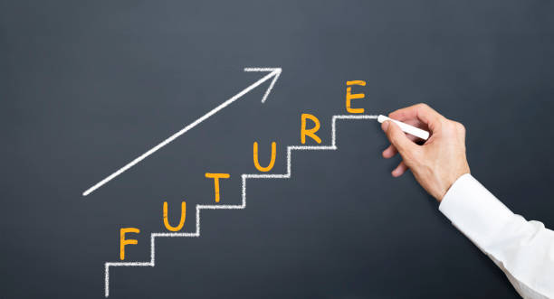 istock man drawing future stairs on blackboard with chalk 1133896984