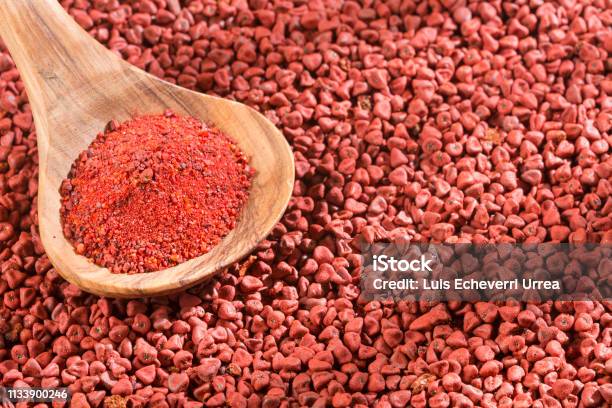 Achiote Seeds And Powder In The Spoon Bixa Orellana Stock Photo - Download Image Now