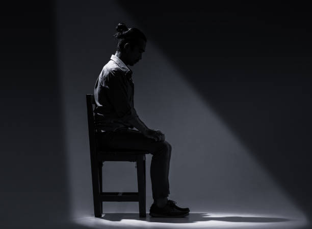 istock An Asian man is suffering from depression in darkness. 1133904374