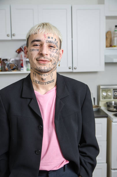 istock Young tattooed man posing in his kitchen 1133908924
