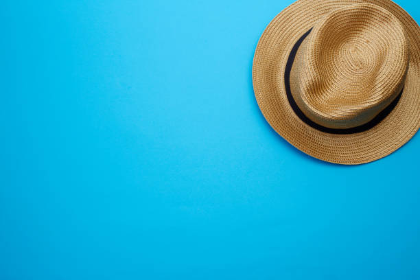 istock Pretty beautiful straw hat on blue background 1133910951