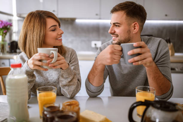 istock Happy Married Couple Having Coffee at Kitchen 1133911107