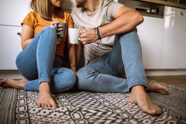 istock Happy Couple Chatting On Kitchen Floor 1133911156