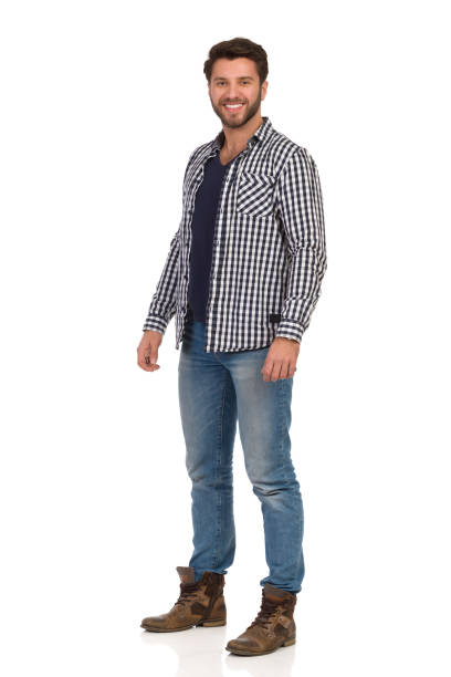 istock Smiling Handsme Man In Jeans And Unbuttoned Lumberjack Shirt 1133913817