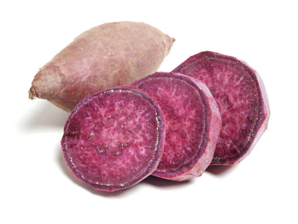istock Purple Colored Sweet Potatoes on White background 1133917412