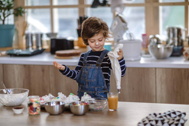 istock Helping His Mom to Make Birthday Muffins 1133919580