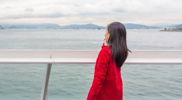 istock Asian Woman Using a Mobile Phone in Hong Kong 1133920672