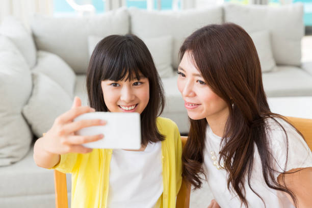 istock asian parent and daughter 1133921337