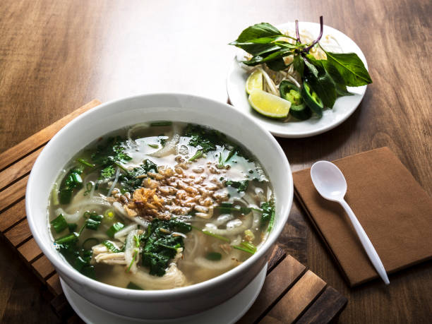 Asian Japanese Chicken Broth Soup With Lime Garnish