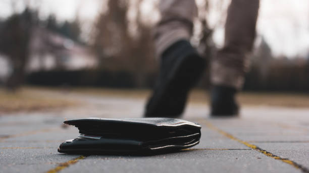 istock Someone walks away from lost wallet 1133924796
