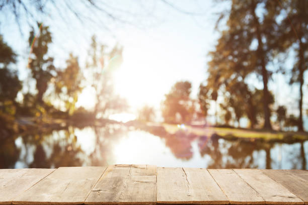 istock Wood Table Top on Blurred Tropical Background 1133928950
