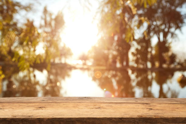 istock Wood Table Top on Blurred Tropical Background 1133928951