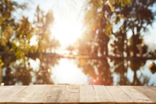istock Wood Table Top on Blurred Tropical Background 1133928953