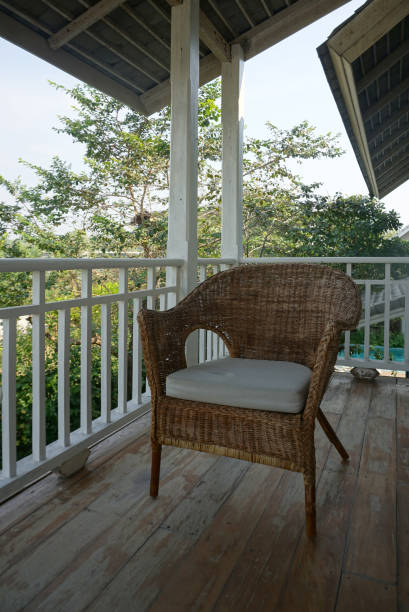 istock Old vintage rattan chair on terrace deck 1133933713