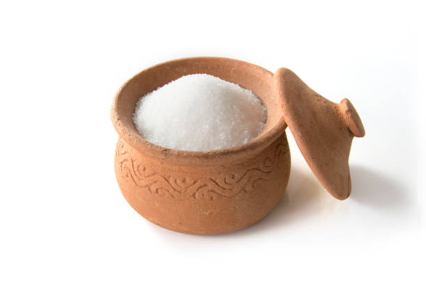 istock Sugar in clay pots isolated on white background 1133940816