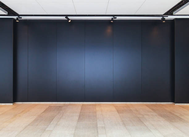 istock wooden floor and black wall background 1133941532