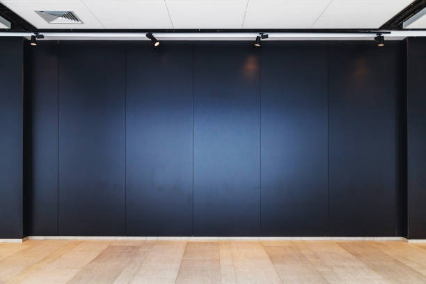 istock wooden floor and black wall background 1133941594