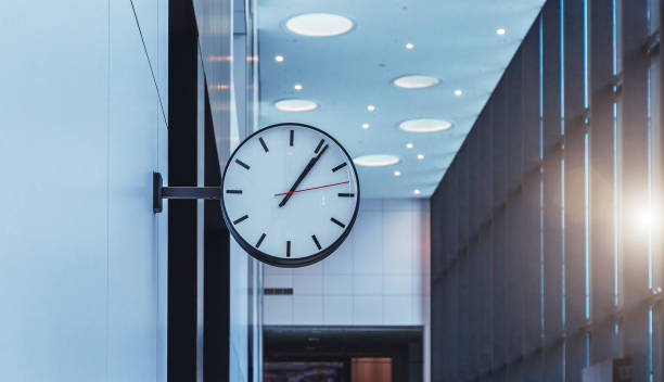 istock wall clock in the business center 1133941636