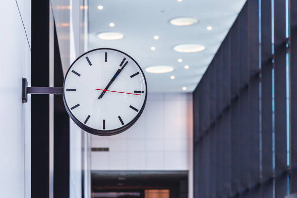 istock wall clock in the business center 1133941638