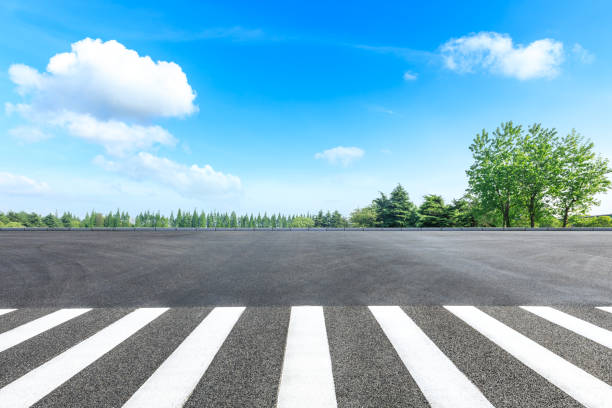 istock Zebra crossing road ground and green forest landscape in summer 1133941668