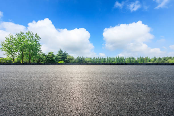 istock Empty asphalt pavement and green forest landscape in summer season 1133941716