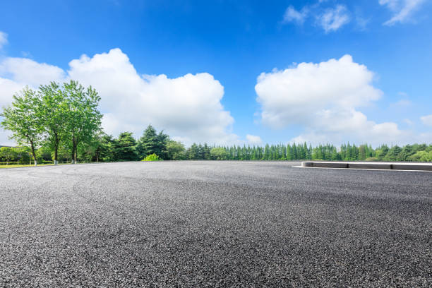 istock Empty asphalt pavement and green forest landscape in summer season 1133941740