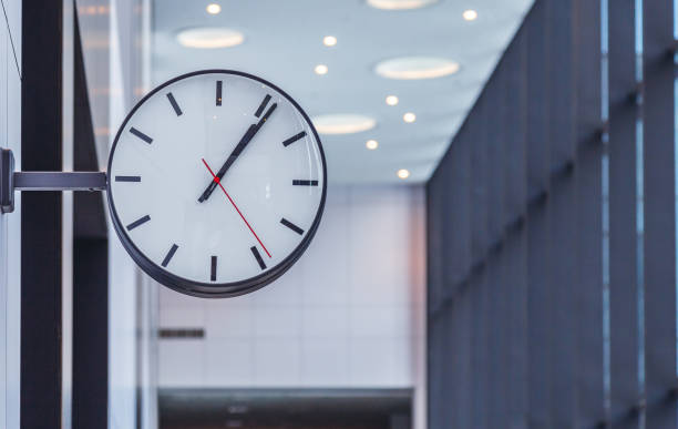 istock wall clock in the business center 1133941741