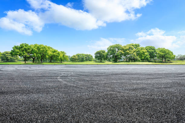 istock Car circuit road ground and green forest in summer 1133941787
