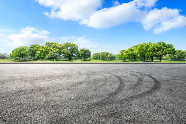 istock Car circuit road ground and green forest in summer 1133941815