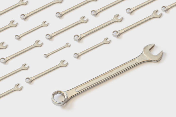 istock Shiny wrench on a bright white background. Pattern for your design 1133944298