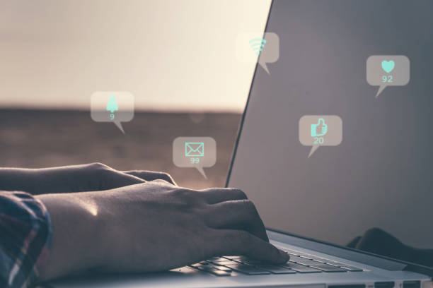 istock Female hand using laptop checking social media with icon technology, modern lifestyle concept. 1133948069