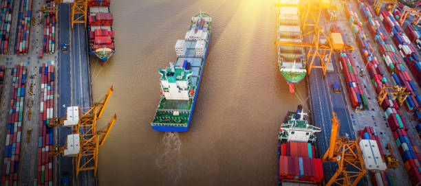 istock Logistics and transportation of Container Cargo ship and Cargo plane with working crane bridge in shipyard, logistic import export and transport industry background 1133948116