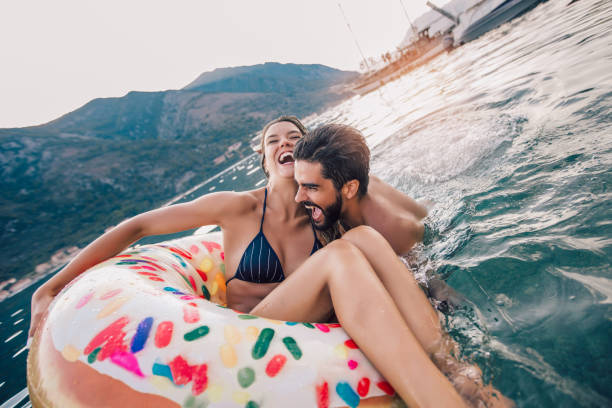 istock Beautiful young couple on the beach having fun 1133952361