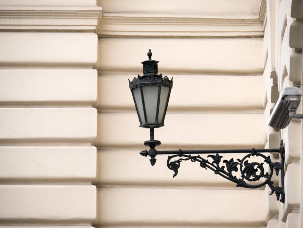 Lonely lantern on the street. An electric lantern is attached to the wall in close-up.