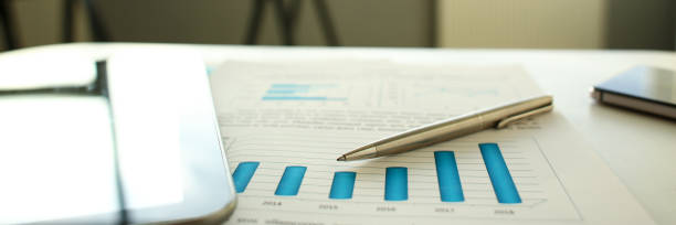 istock Silver pen lie at important paper on table 1133953693