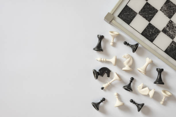 istock Chess board and chess figures on white background top view copy space. Symbol of competition. 1133954856
