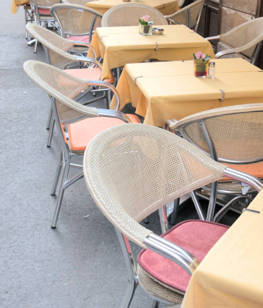 istock Comfortable seats and elegant tables in a street cafe. 1133958296