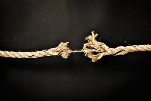 nervous tension: frayed rope about to snap - rope frayed emotional stress breaking imagens e fotografias de stock