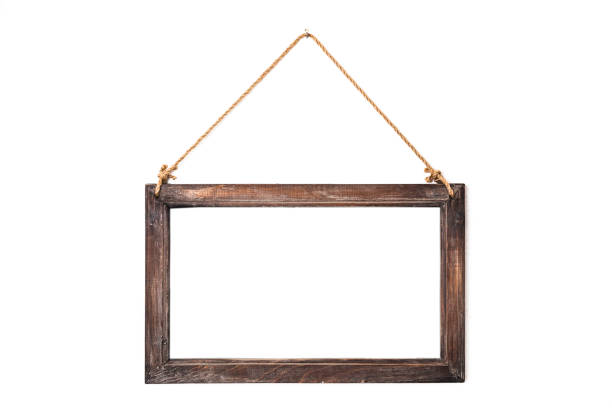 istock Old notice board frame, hanged on insulated white wall - stock image 1133958443
