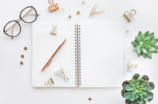 istock Elegant work table with business accessories on withe background.luxury feminism style 1133959135