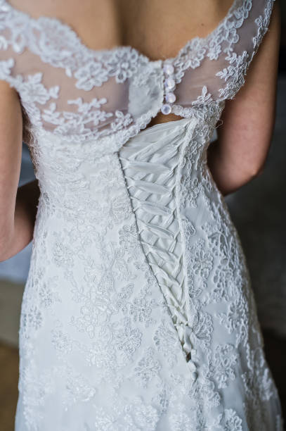 istock Lace white wedding dress, rear view. 1133959446