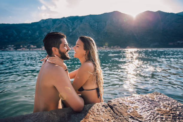 istock Beautiful young couple on the beach having fun 1133962765