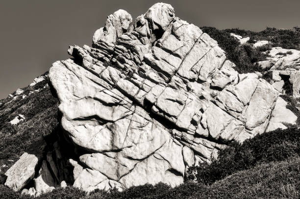 Corsican granite in black and white black and white close-up of the eroded granite rocks of the Corsican coastline image en noir et blanc stock pictures, royalty-free photos & images