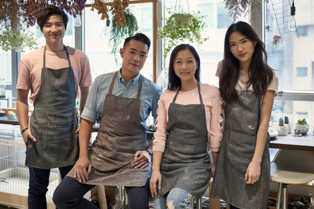 istock Portrait of confident owners in pottery workshop 1133966317