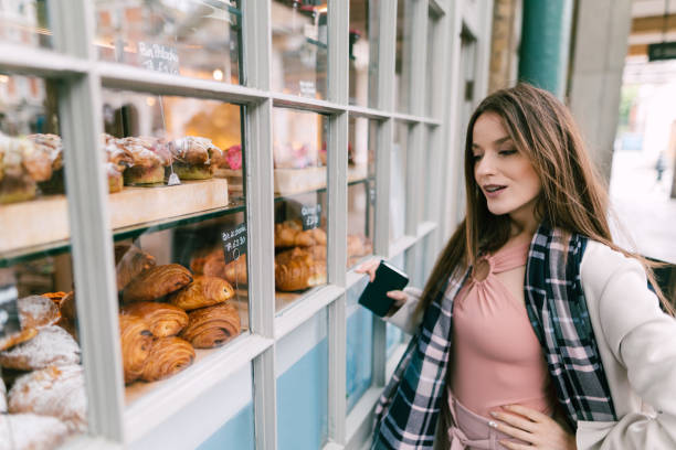 istock Hungry woman at the bakery 1133967058